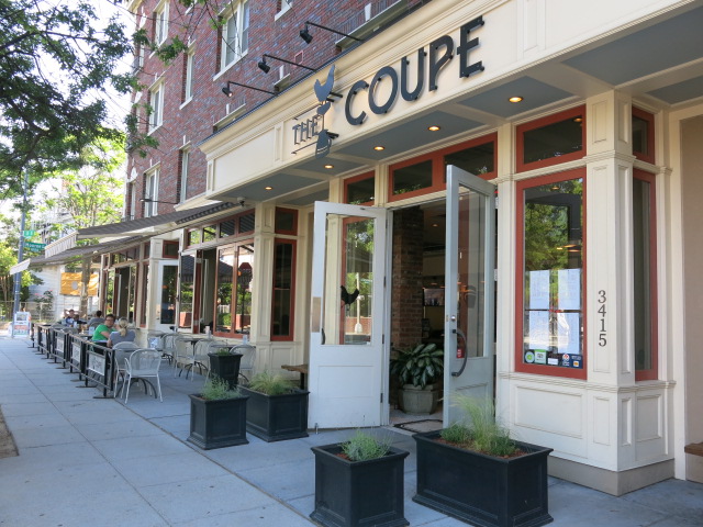 The real white-painted facade and sidewalk seating at The Coupe on 11th Street NW